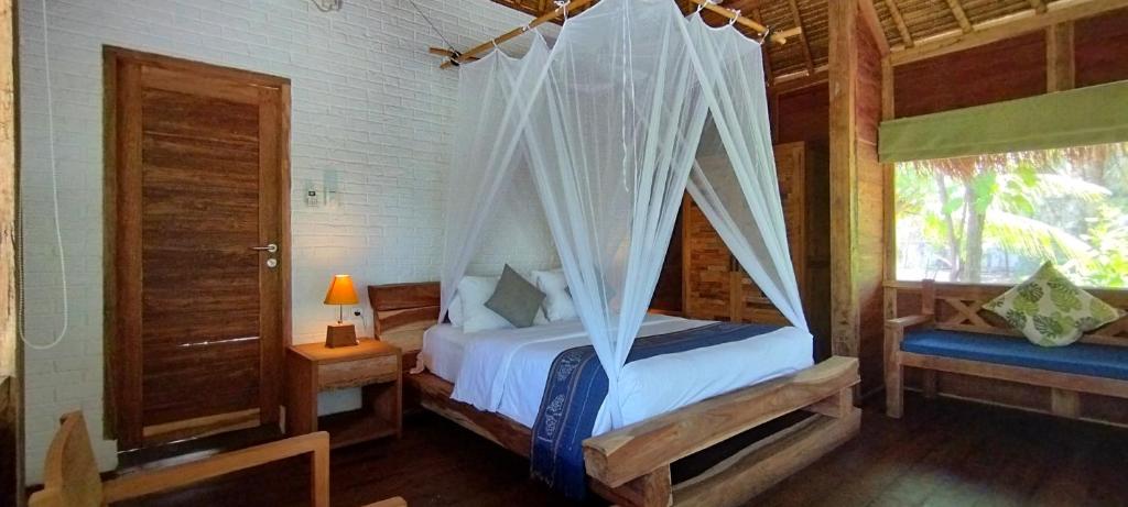 Postel nebo postele na pokoji v ubytování Amrita Maumere Resort