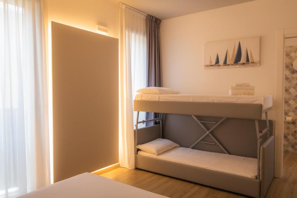 Postel nebo postele na pokoji v ubytování La Casa Di Filò Boutique