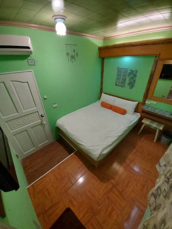 Postel nebo postele na pokoji v ubytování 韖旅店-民宿編號1158