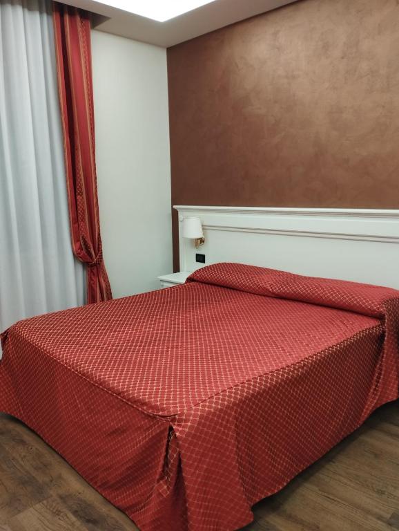 Postel nebo postele na pokoji v ubytování Hotel Galimberti