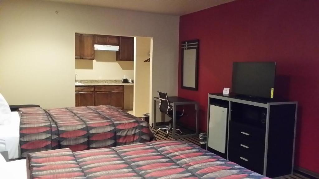 Postel nebo postele na pokoji v ubytování Texan Inn and Suites Tilden