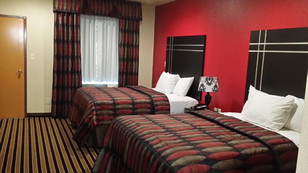 Postel nebo postele na pokoji v ubytování Texan Inn and Suites Tilden