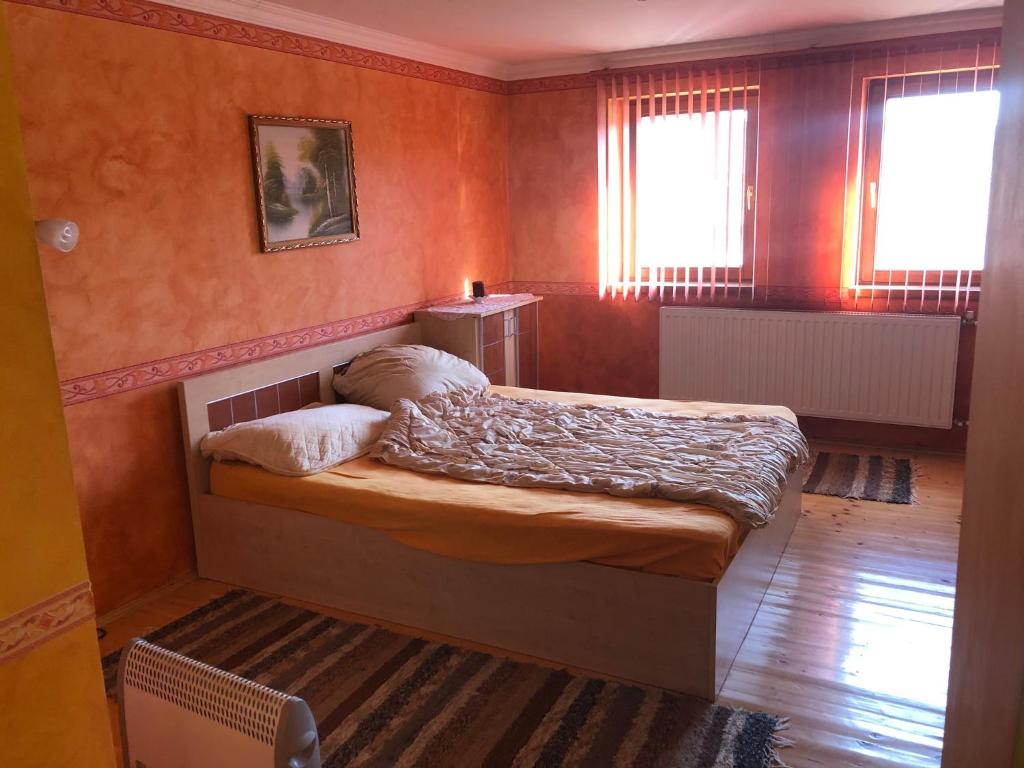 Posteľ alebo postele v izbe v ubytovaní Budai Vendégház