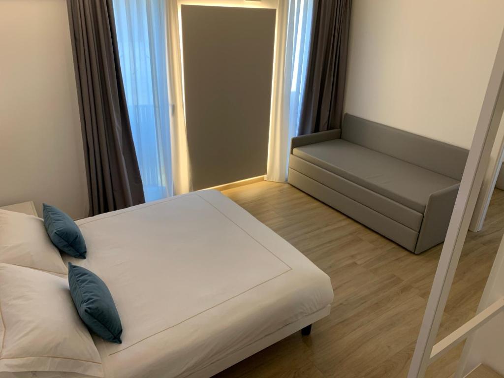 Postel nebo postele na pokoji v ubytování La Casa Di Filò Boutique