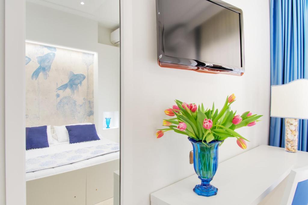 TV a/nebo společenská místnost v ubytování Hotel Caesar Residence & SPA