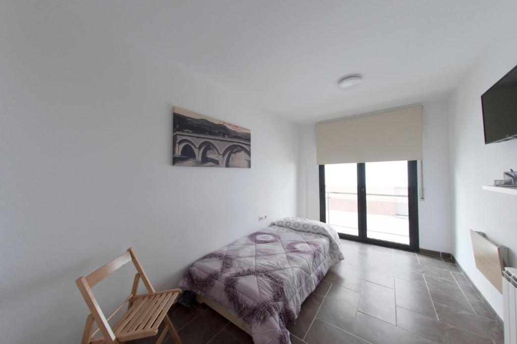 Posteľ alebo postele v izbe v ubytovaní Apartament Bisaura de Ter