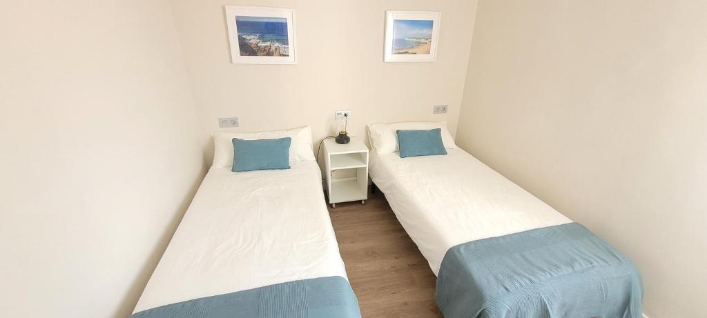 Postel nebo postele na pokoji v ubytování SANNIKO APARTMENT Ático con Terraza