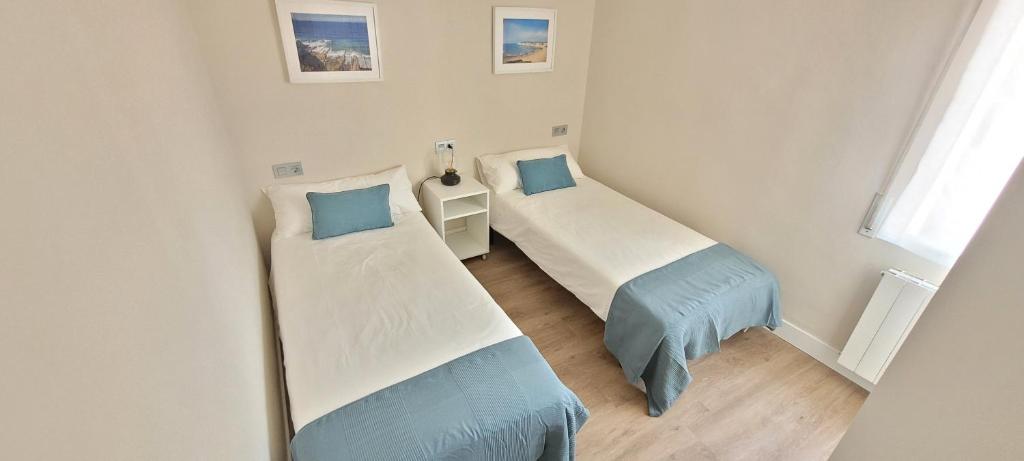 Postel nebo postele na pokoji v ubytování SANNIKO APARTMENT Ático con Terraza