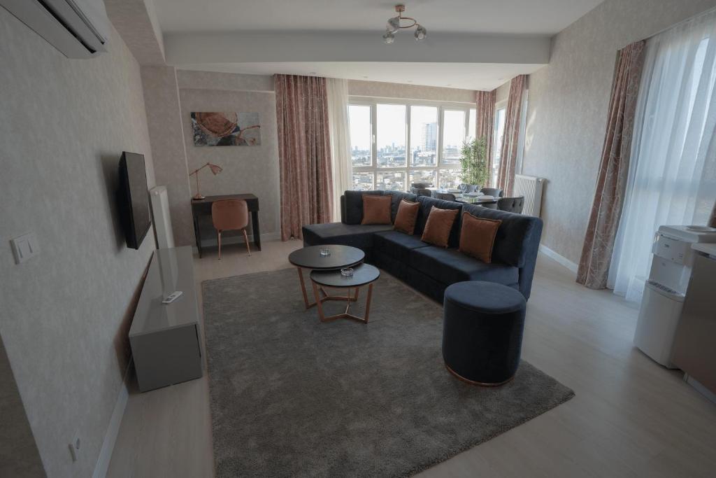 Posezení v ubytování Stylish 2-bedroom Apartment near Mall of Istanbul - Exp 215