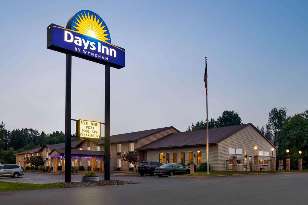 a sign for a days inn in front of a building at Days Inn by Wyndham Hurley in Hurley