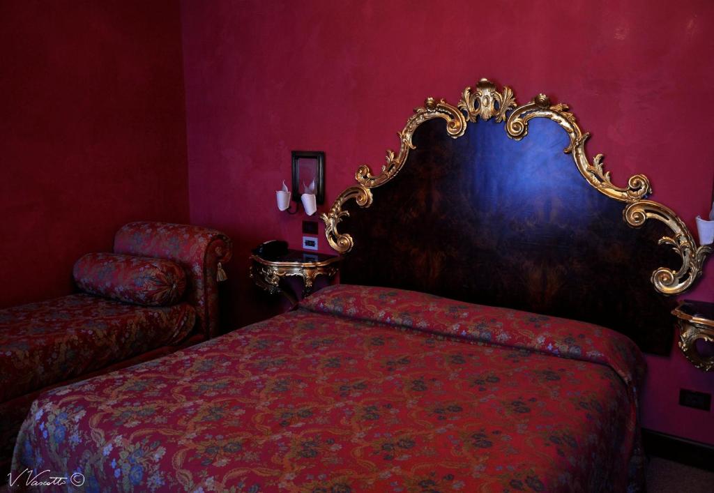 Postel nebo postele na pokoji v ubytování Residenza d'Epoca San Cassiano