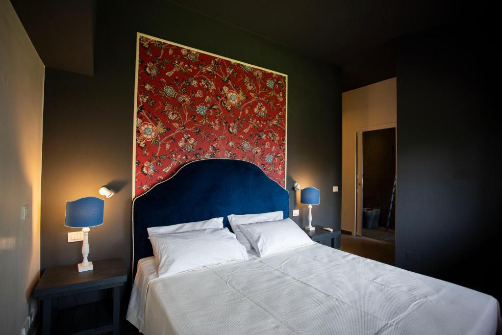 A bed or beds in a room at Citrus, between Etna and the Sea