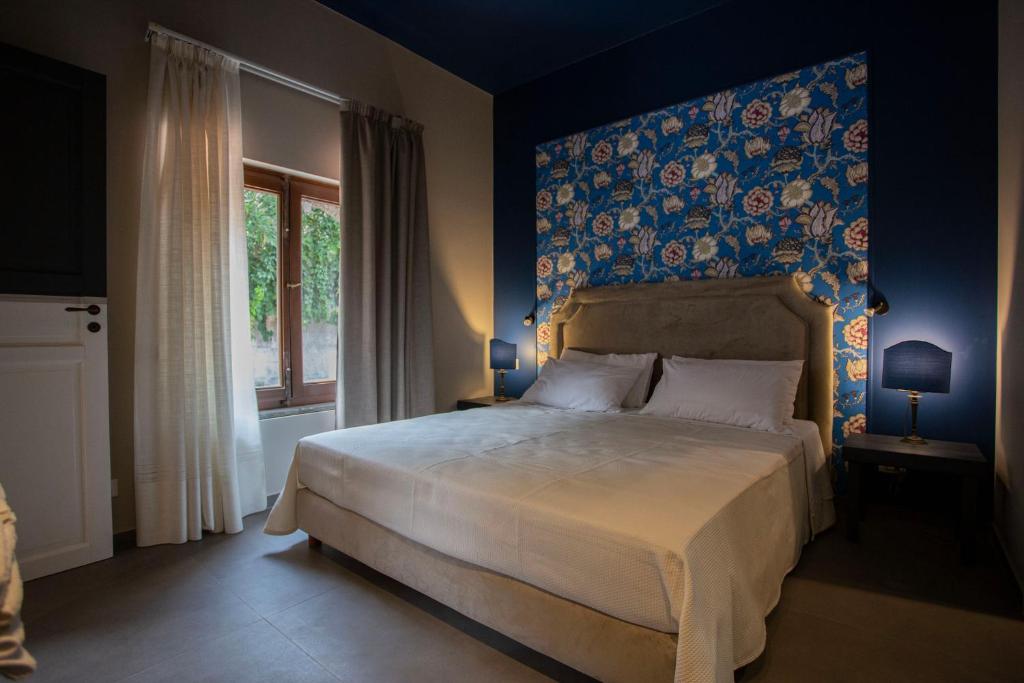 A bed or beds in a room at Citrus, between Etna and the Sea
