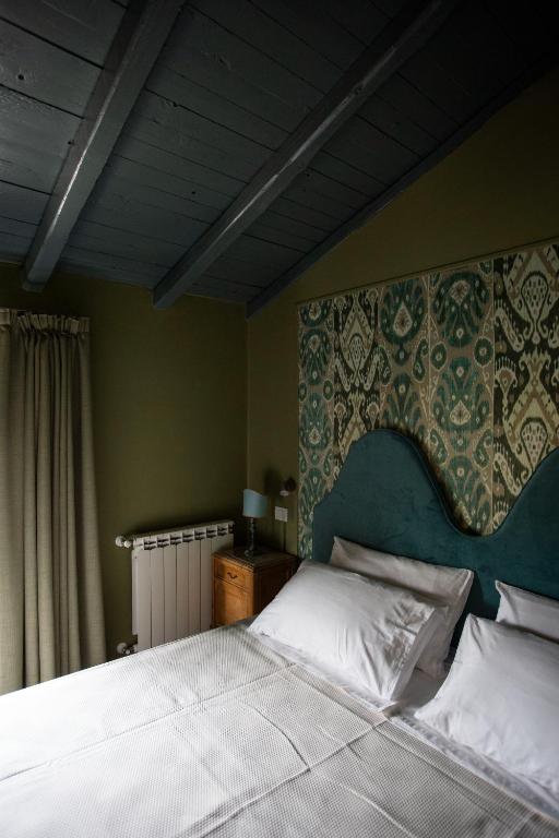A bed or beds in a room at Citrus, between Etna and the Sea