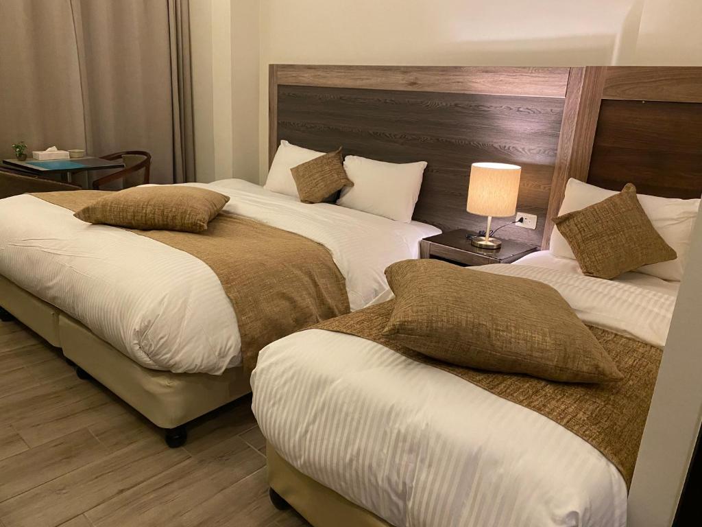 Postel nebo postele na pokoji v ubytování Moses Residence