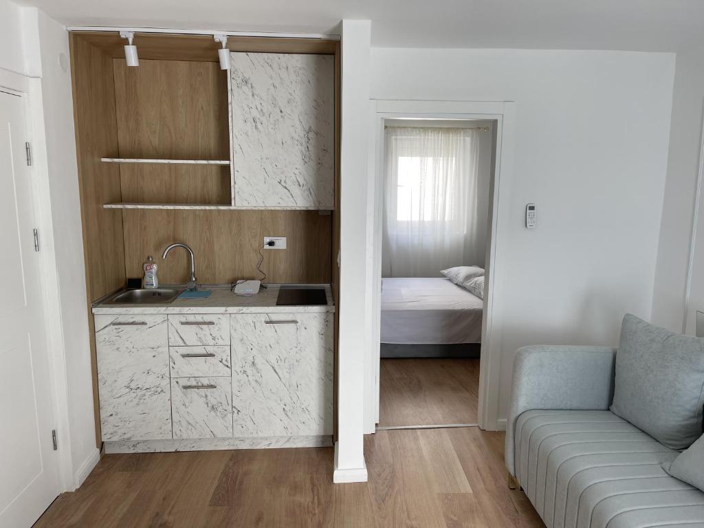 Letto o letti in una camera di Lungomare Apartments