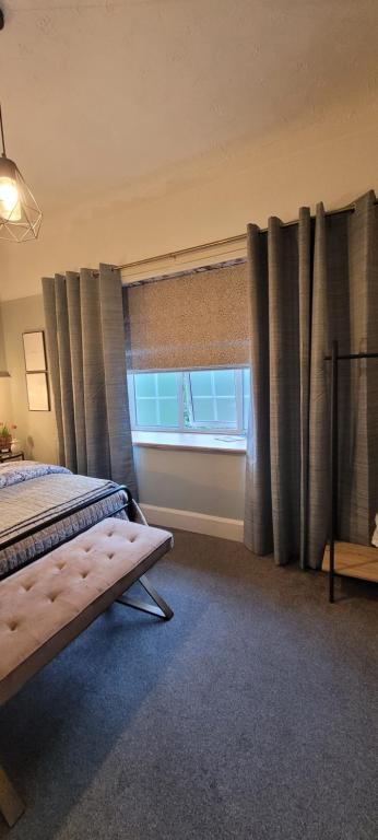 Postel nebo postele na pokoji v ubytování Rigsbys Guesthouse Doncaster