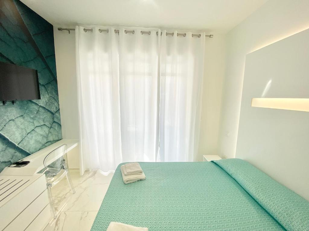 เตียงในห้องที่ IL VIAGGIATORE RELAIS SUL MARE