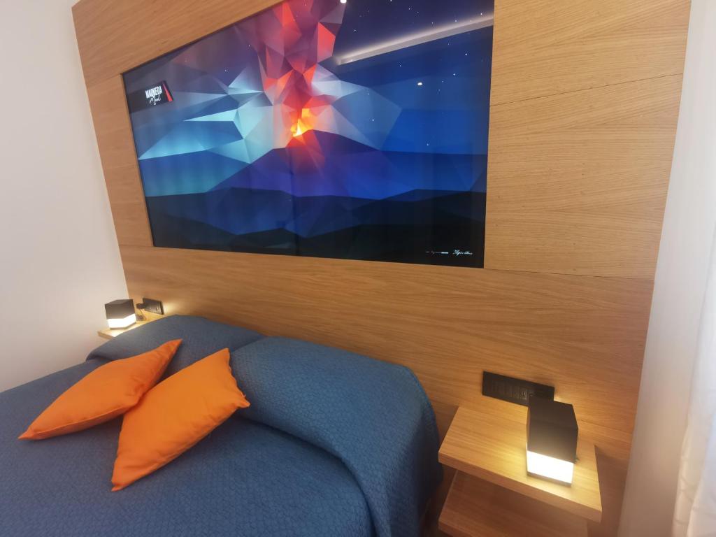 Postel nebo postele na pokoji v ubytování Maqueda Mood
