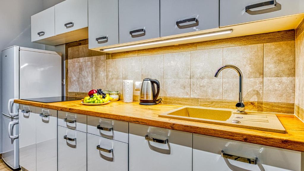 Kuchyňa alebo kuchynka v ubytovaní Apartament Angelika B1 - 5D Apartamenty