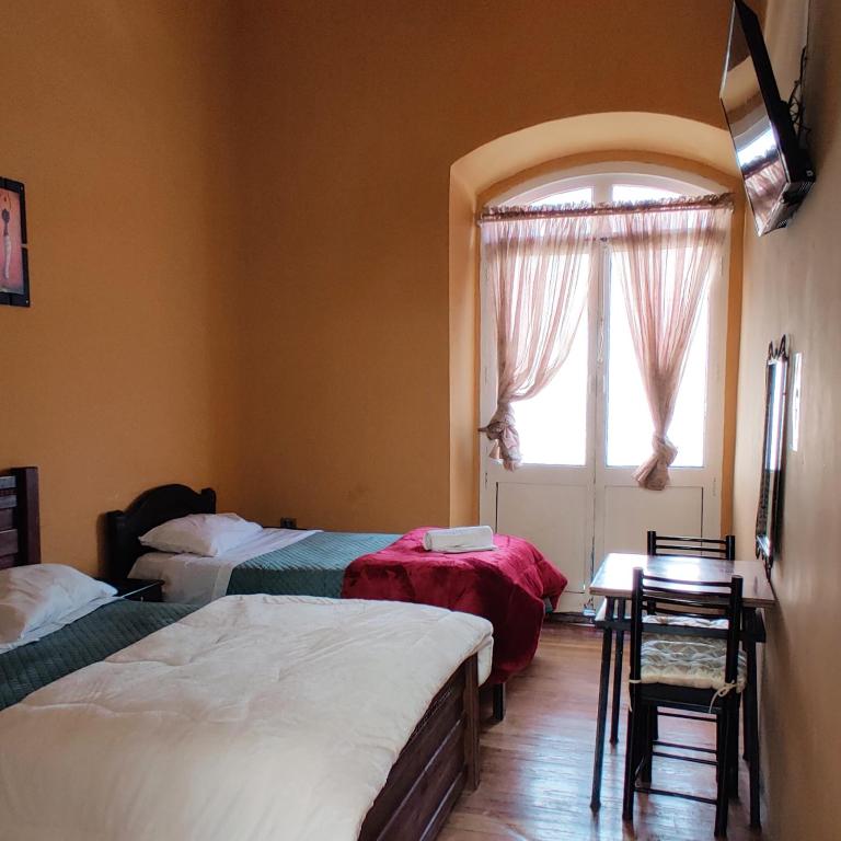 Postel nebo postele na pokoji v ubytování Wake Up Hostel