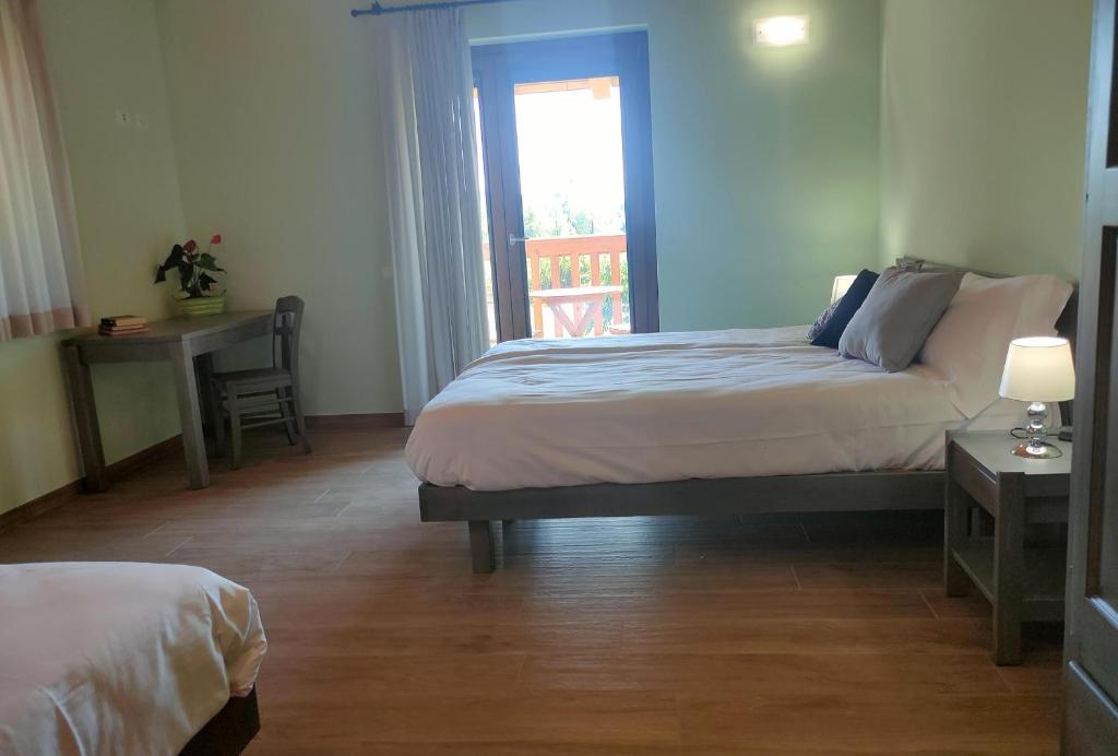 Postel nebo postele na pokoji v ubytování Le Acacie