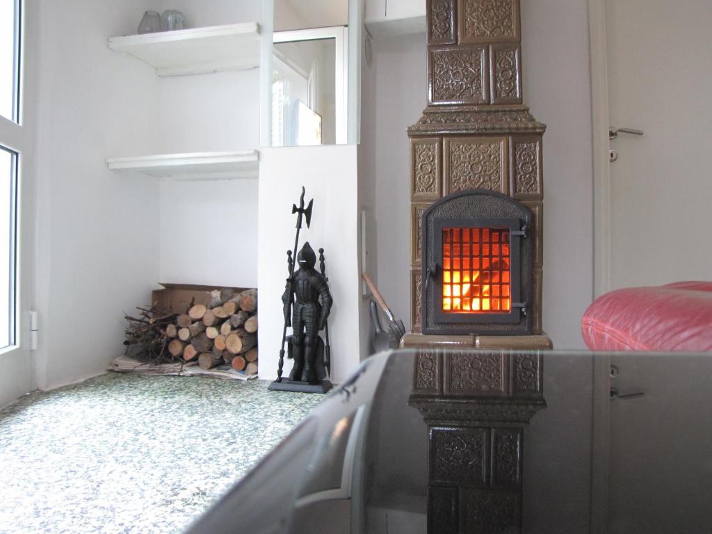 a room with a fireplace in the corner of a room at Holiday Home Momcilovic in Malinska