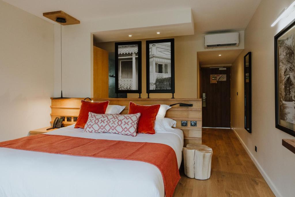 Postel nebo postele na pokoji v ubytování Sarana Hôtel & Spa