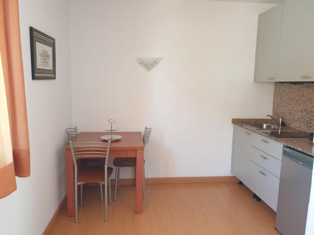 Kuchyň nebo kuchyňský kout v ubytování Aparthotel Arenal