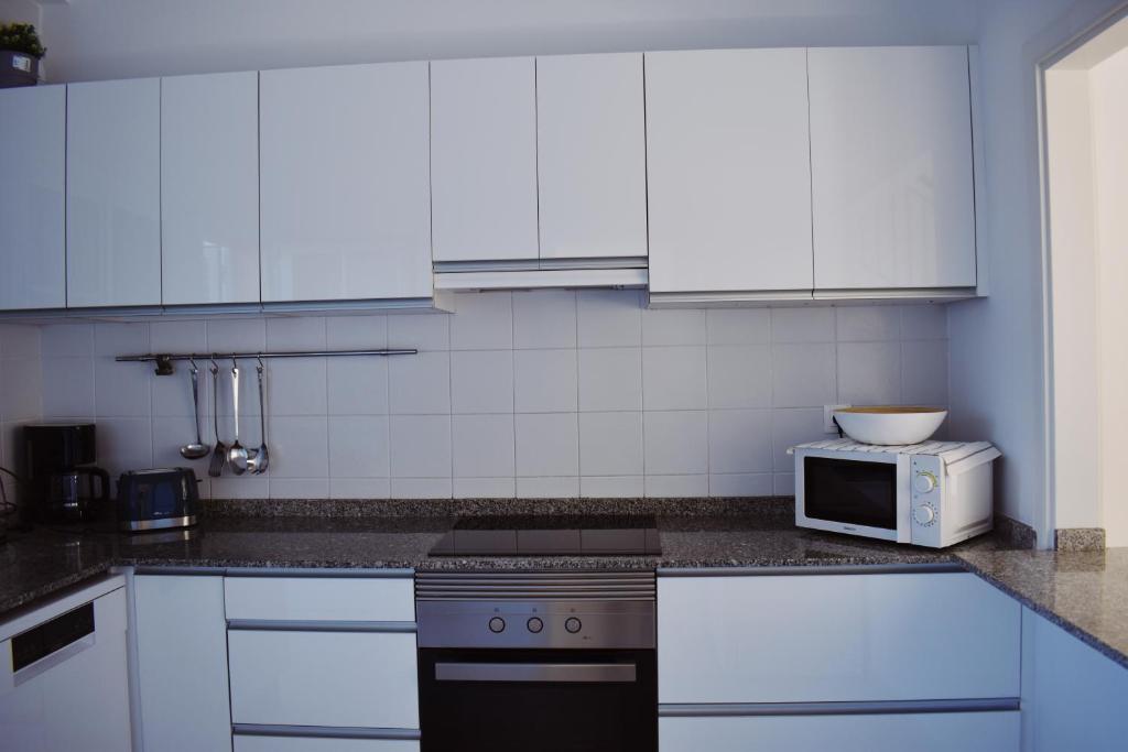 Kuchyň nebo kuchyňský kout v ubytování Duplex en Meloneras