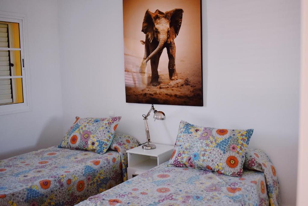 Postel nebo postele na pokoji v ubytování Duplex en Meloneras