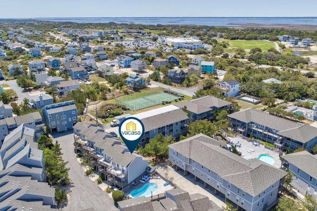 an aerial view of a resort building with a pool at 5280 Waves in Corolla