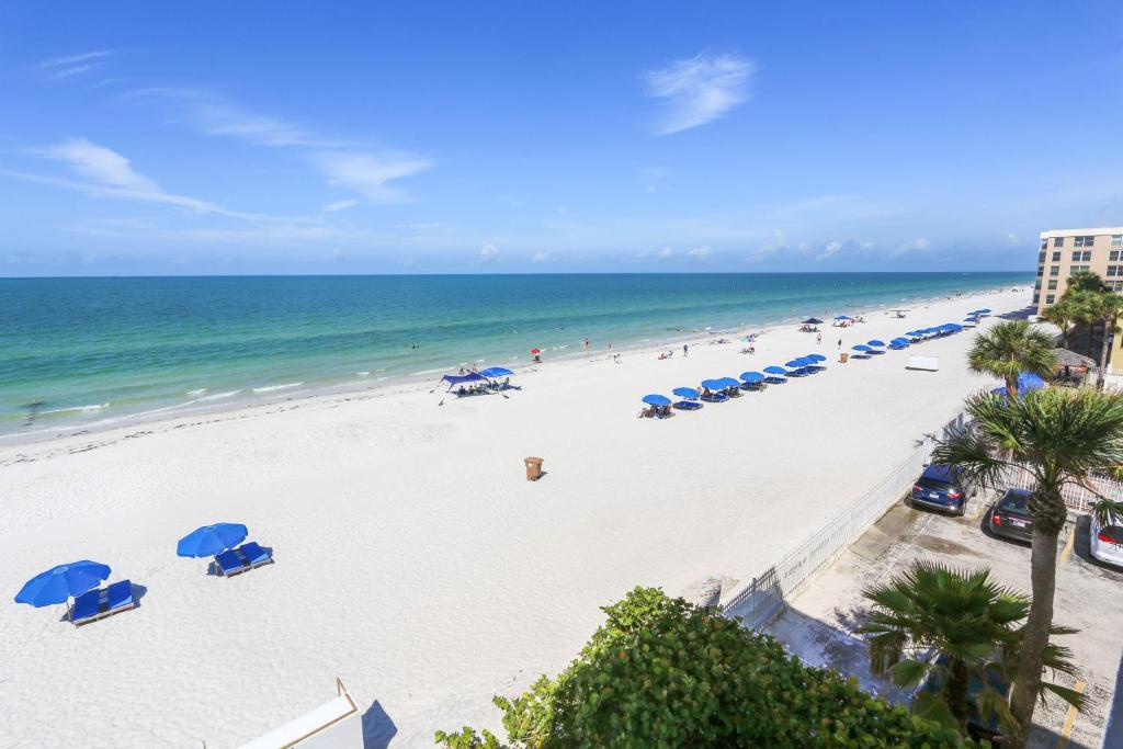 an overhead view of a beach with umbrellas and the ocean at Arie Dam 304 in St Pete Beach