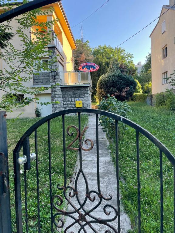 a gate in front of a house at Marakana Apartment-free parking space 2 in Dedinje
