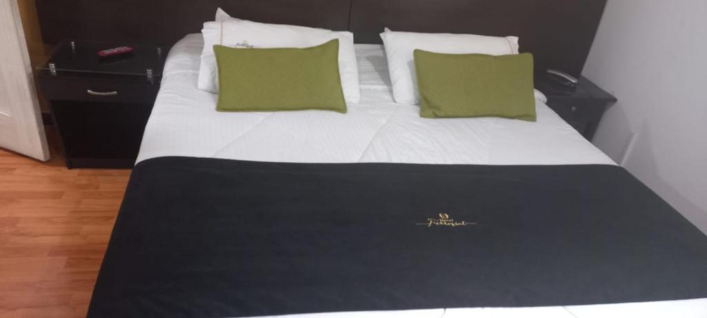 Postel nebo postele na pokoji v ubytování Hotel Ferrovial Corferias