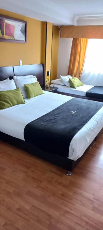 Postel nebo postele na pokoji v ubytování Hotel Ferrovial Corferias