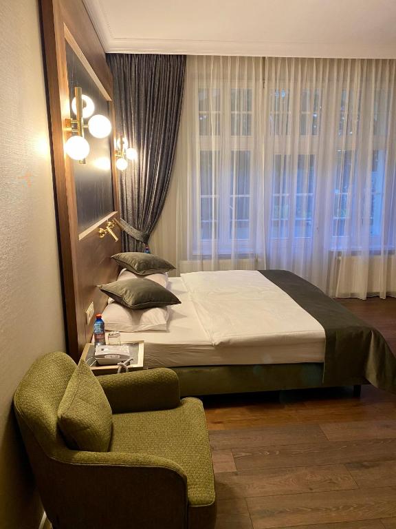 Łóżko lub łóżka w pokoju w obiekcie Pensjonat - Restauracja Żółty Domek