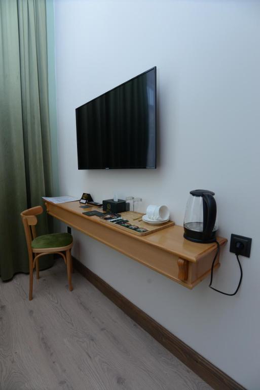 TV a/nebo společenská místnost v ubytování Old Avenue Hotel