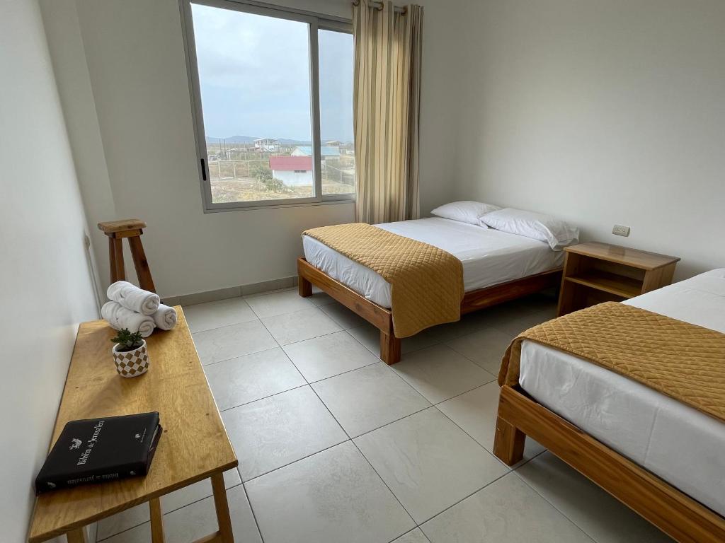 Postel nebo postele na pokoji v ubytování Samana Hostal, Puerto Engabao