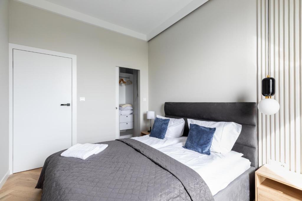 Posteľ alebo postele v izbe v ubytovaní P&O Apartments Rydygiera II