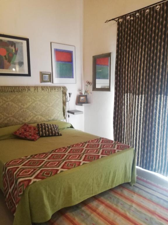 Posteľ alebo postele v izbe v ubytovaní Arimatea Casa Vacanza