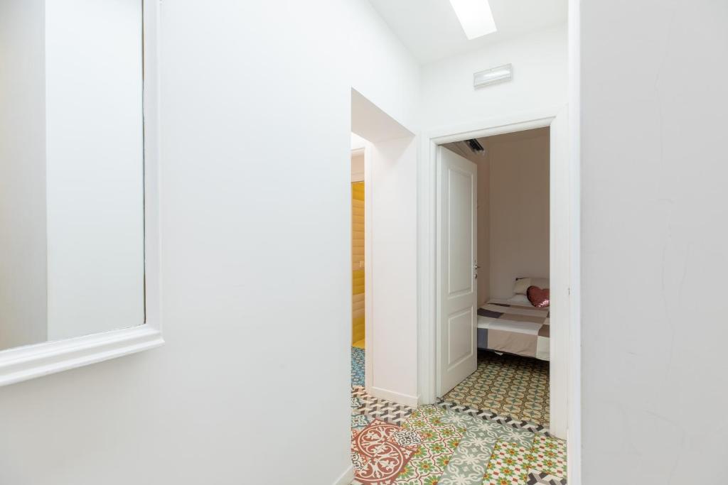 A bed or beds in a room at COLOSSEO con il CUORE