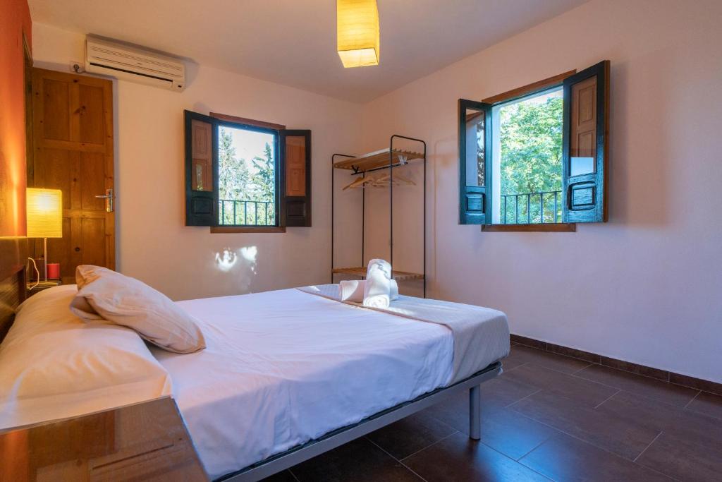 A bed or beds in a room at El jardín del botánico