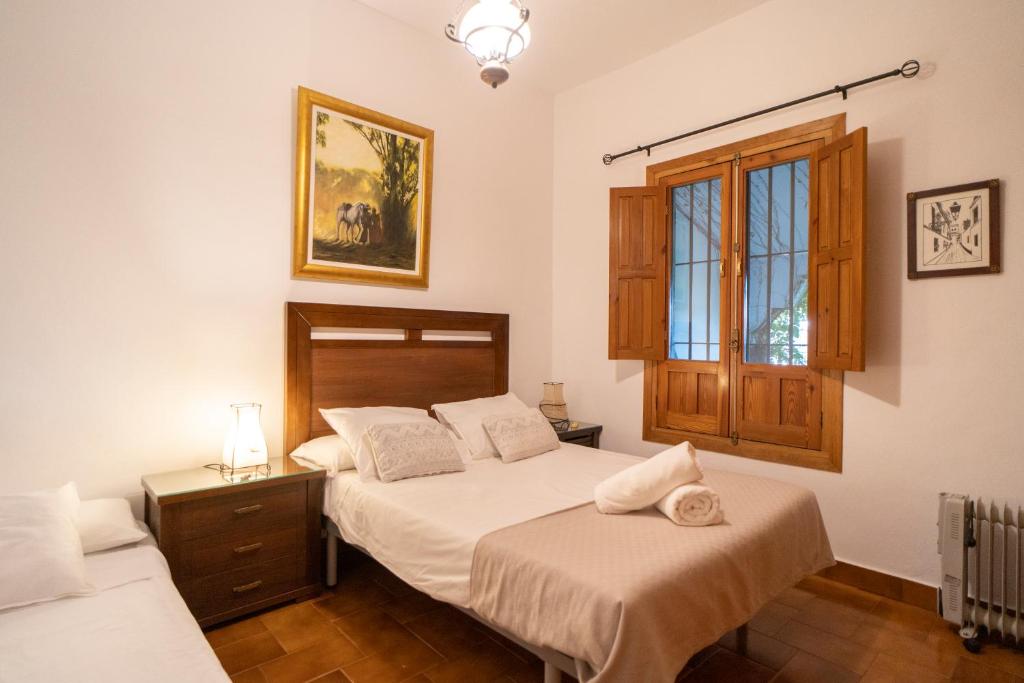 A bed or beds in a room at El jardín del botánico
