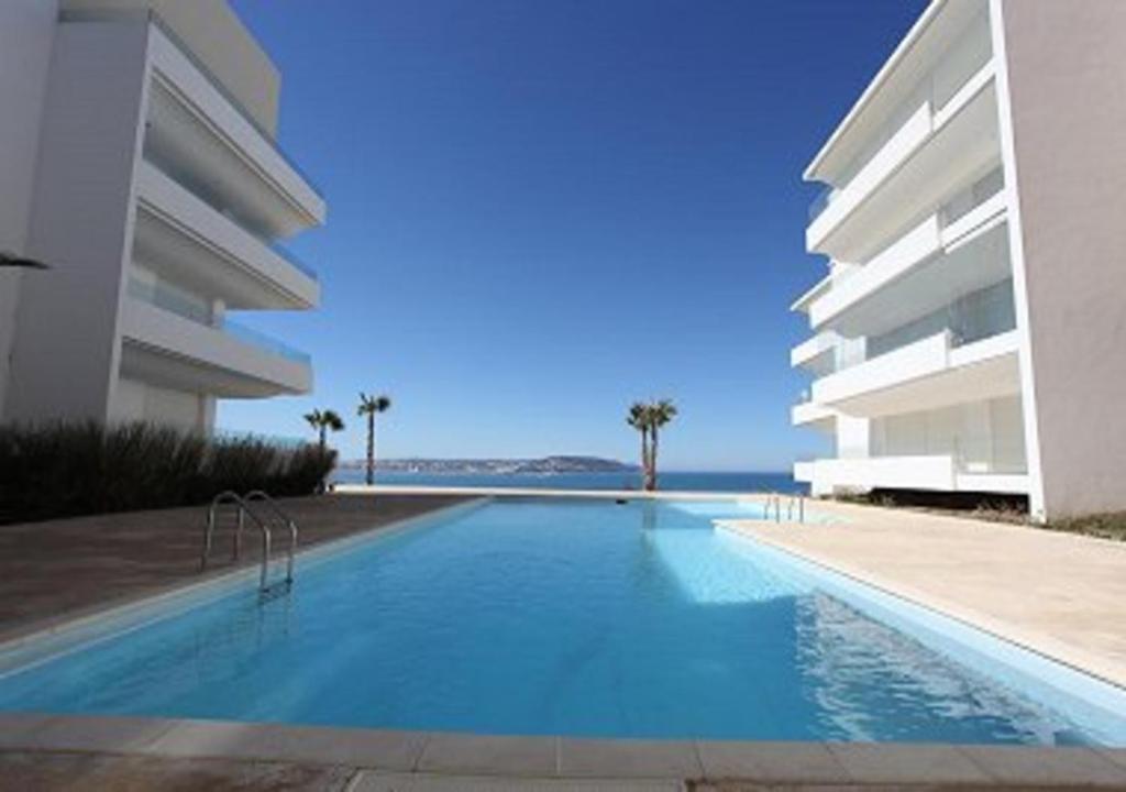 een groot zwembad voor een gebouw bij Intimate Apartment with a beautiful view in Tanger