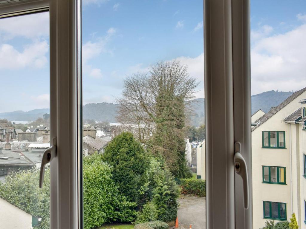 a window with a view of a city at The Hollies in Bowness-on-Windermere