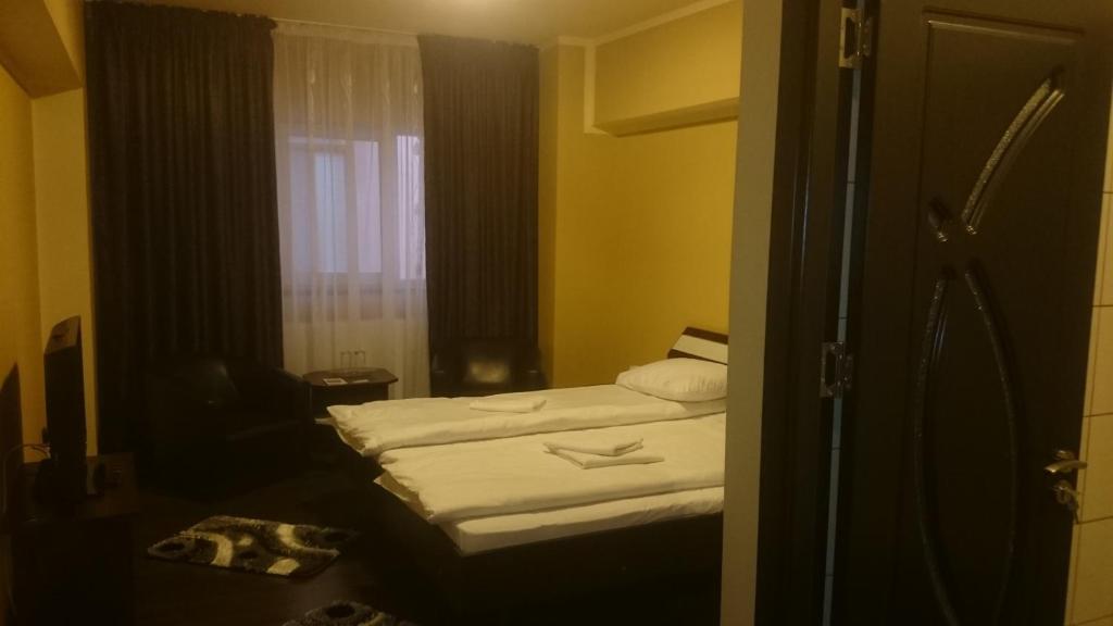 Postel nebo postele na pokoji v ubytování Vila Crinul