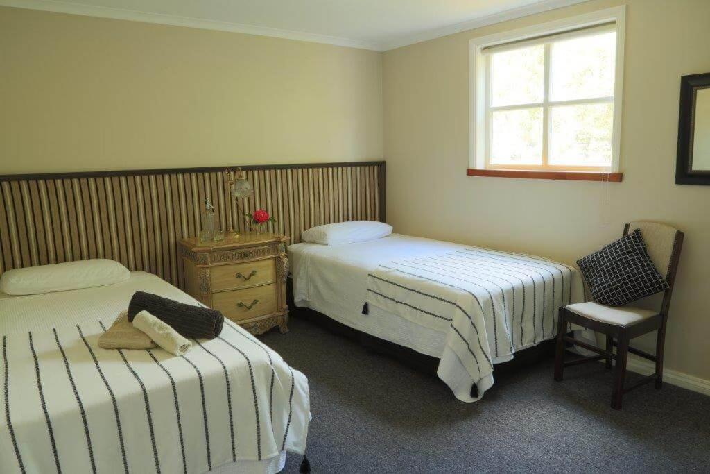 Postel nebo postele na pokoji v ubytování Blackfern cottage