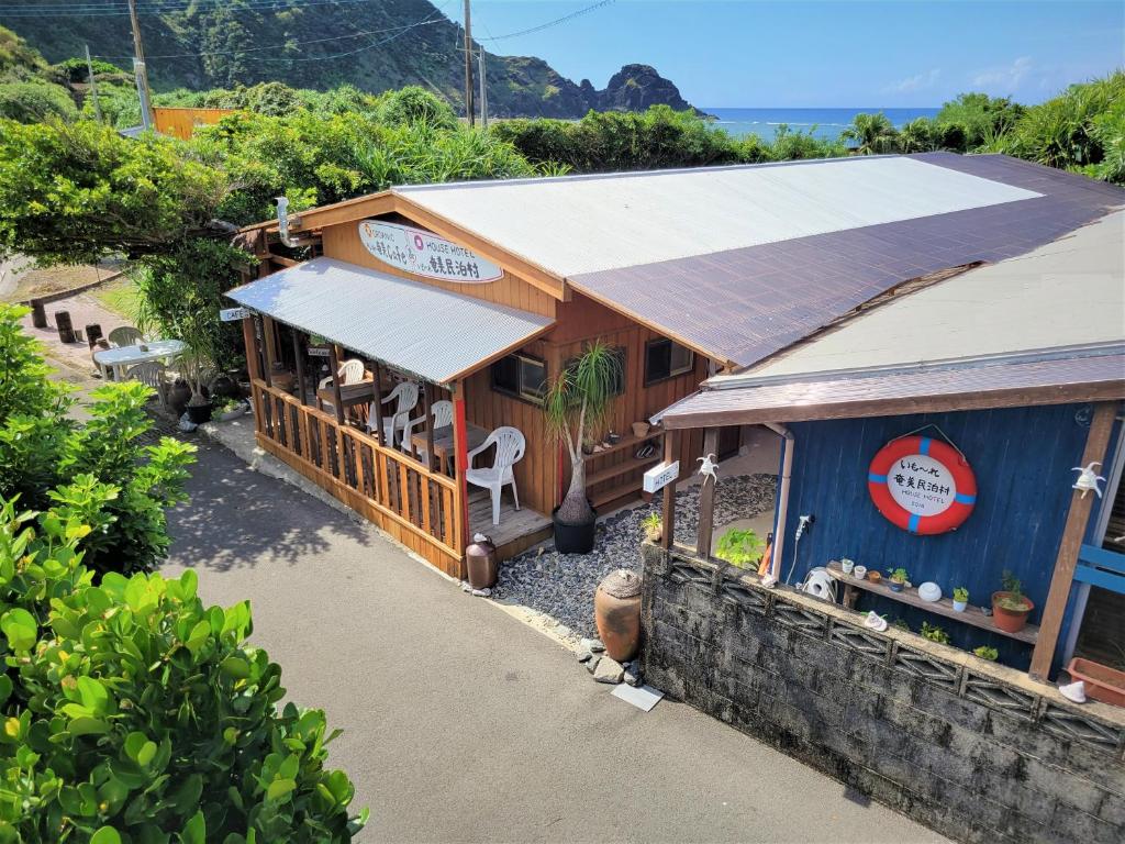 an overhead view of a restaurant with a building at House Hotel Amami Minpaku Mura & Sauna in Amami