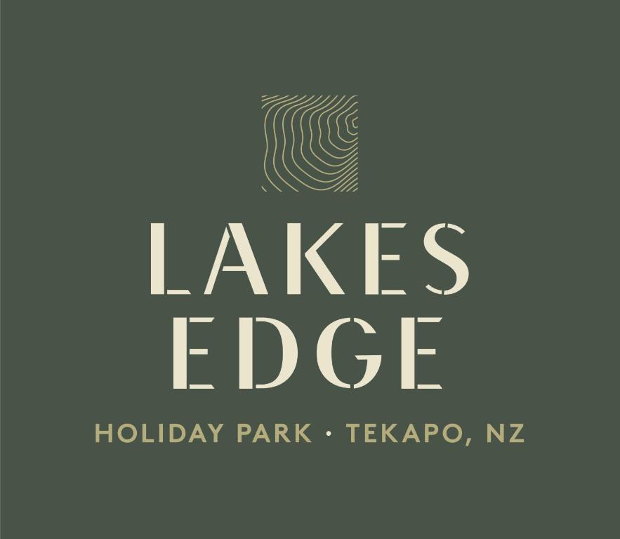 a black and white photo of a sign at Lakes Edge Holiday Park in Lake Tekapo